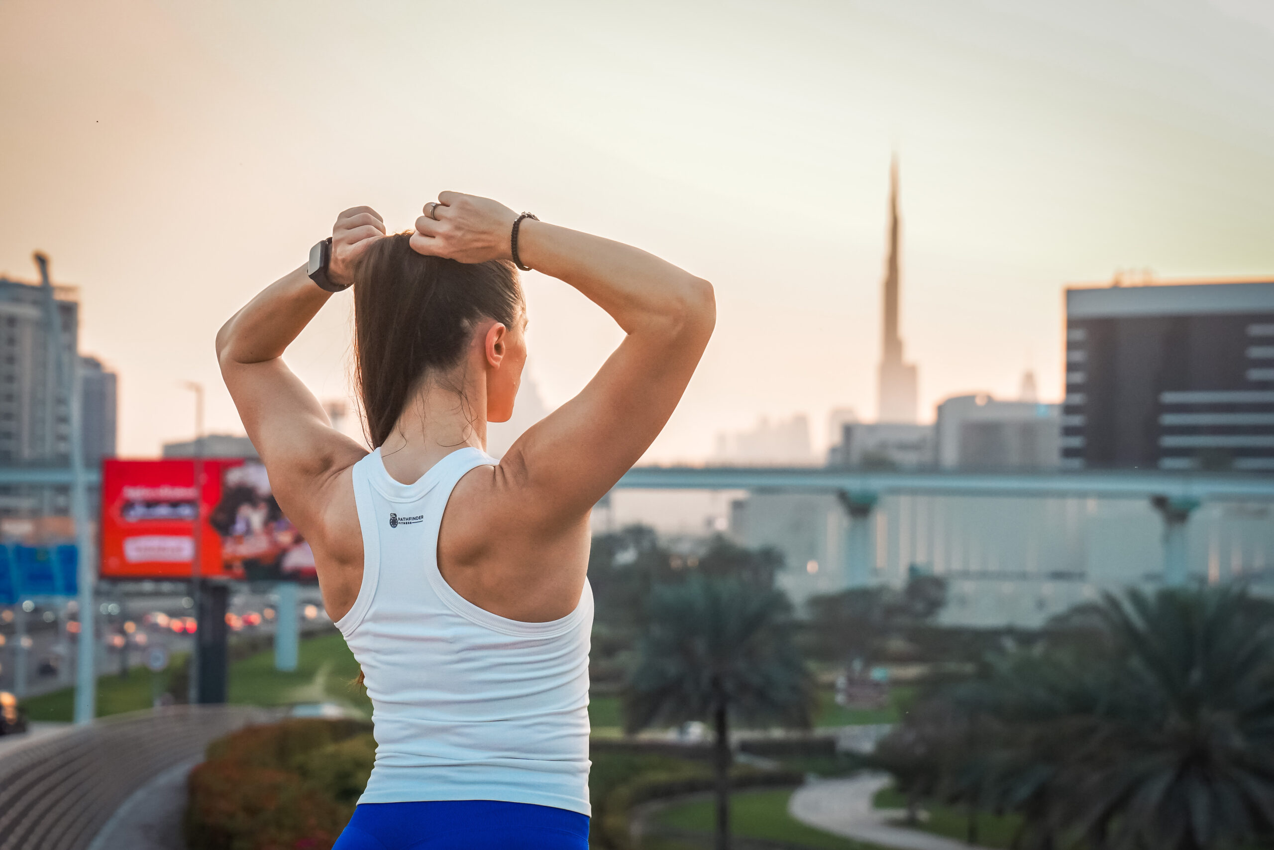 Women's wearing White Tank Top - Pathfinder Fitness